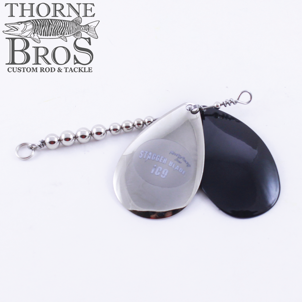 Musky Frenzy Blade Attachments showing two metal spinner blades, one polished silver and one black, connected by a beaded wire for use in fishing tackle.