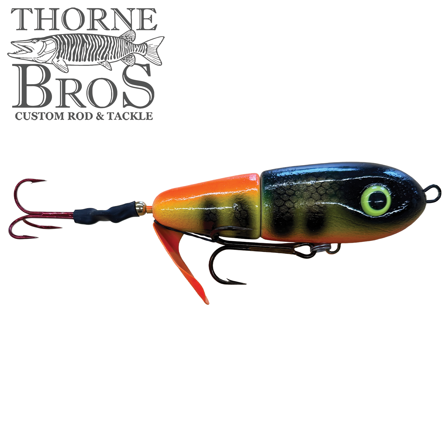 Close-up of a Lake-X Dr. Evil fishing lure featuring a segmented body with black, orange, and yellow colors, detailed scale texture, large eye design, and multiple sharp hooks.