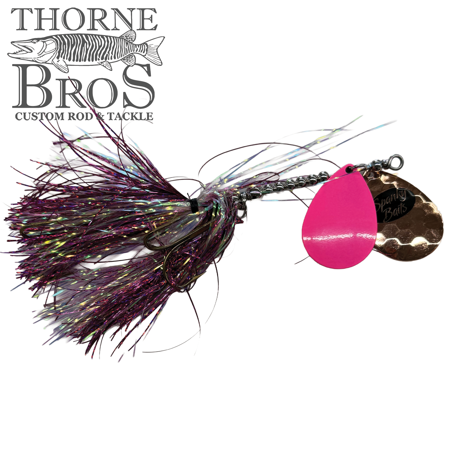 Spanky Baits Fireball 8" fishing lure with purple and iridescent skirt, two spinning blades in pink and copper, designed for musky fishing tackle.
