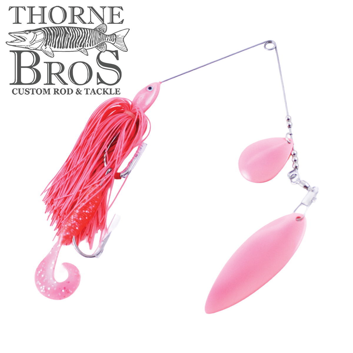 Ace Baits Big Ace Spinnerbait pink and red musky fishing lure with twin pink blades and a curled soft plastic trailer shown with Thorne Bros Custom Rod and Tackle logo