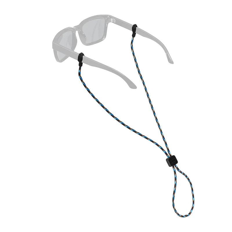 Chums Slip Fit Sunglasses Retainer shown attached to a pair of gray sunglasses, featuring a braided black, blue, and brown cord with adjustable black plastic slider for secure fit during outdoor fishing activities.
