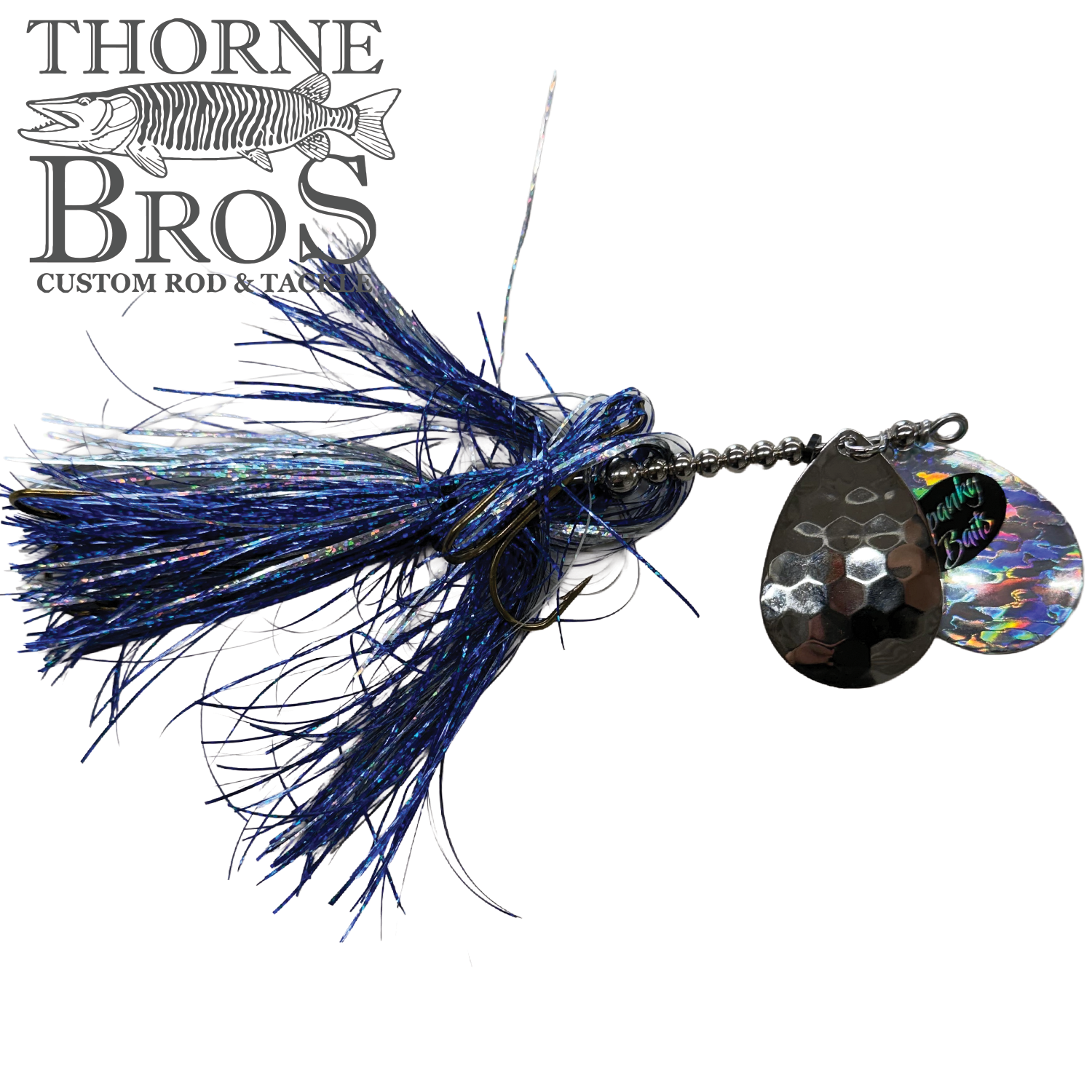 Close-up of a Spanky Baits Fireball 8" fishing lure featuring blue and black synthetic fibers with reflective, hammered metal spinner blades designed for attracting musky.