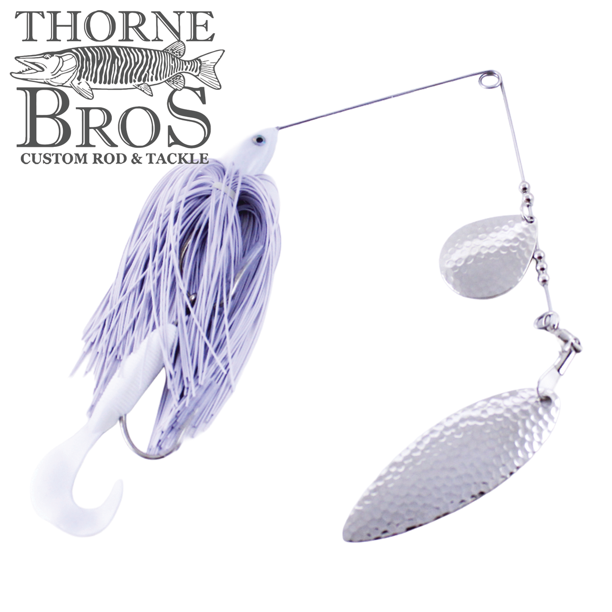 Ace Baits Big Ace Spinnerbait with a white and lavender skirt soft plastic trailer and two hammered silver blades for musky fishing tackle