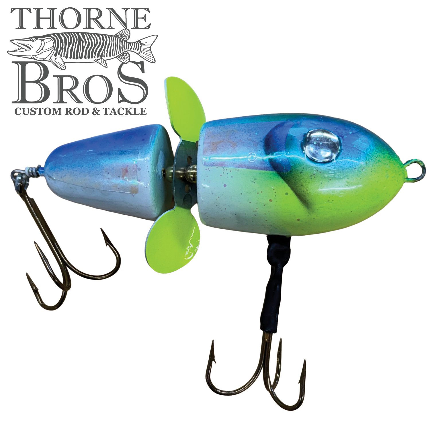 Lake-X Hammer fishing lure in blue and green hues with two treble hooks and a yellow propeller, designed for musky fishing by Thorne Bros.