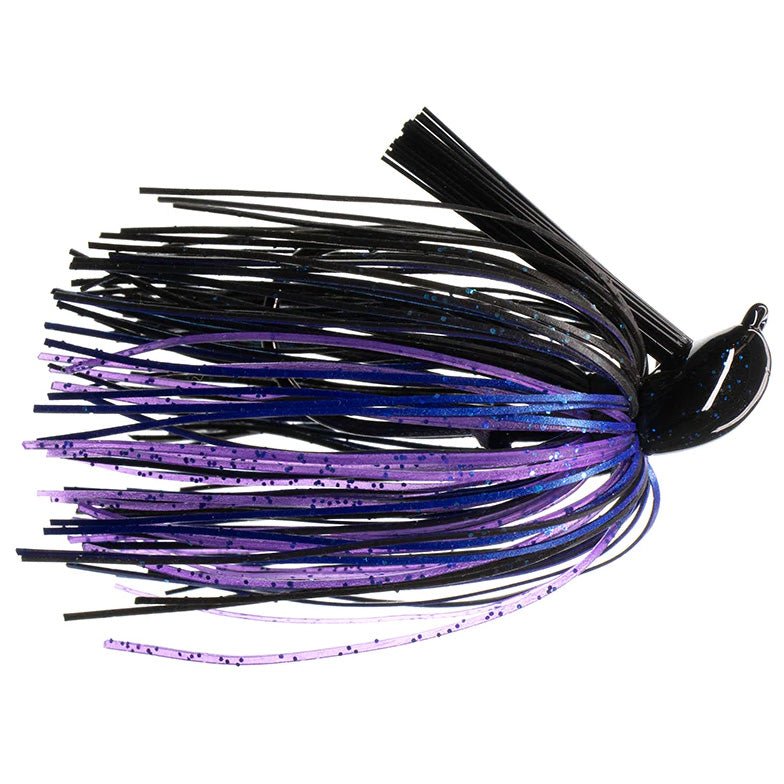 Dirty Jigs Tour Level Pitchin' Jig featuring a black and purple skirt with speckled accents and a weighted head, designed for effective fishing tackle use.