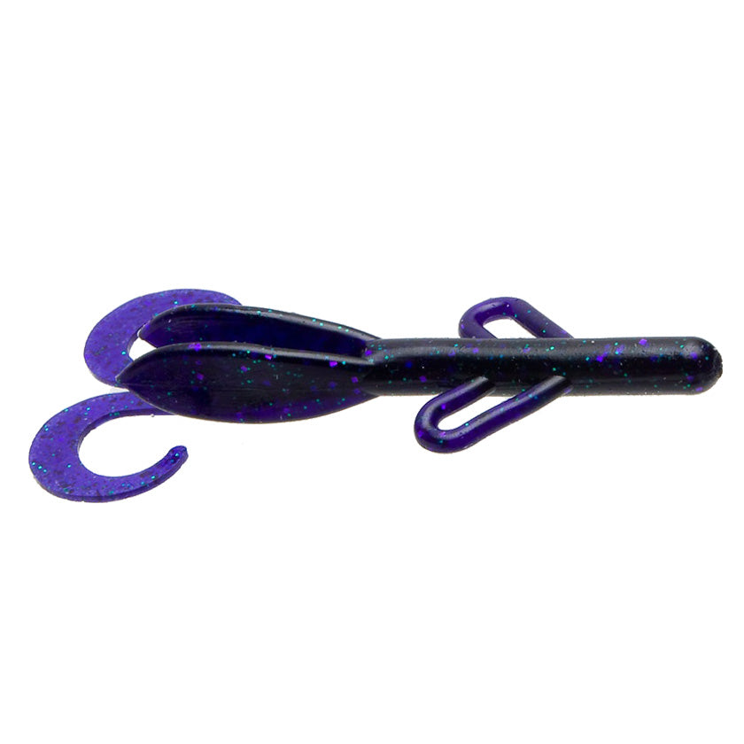 Zoom Baby Brush Hog fishing lure in dark purple with blue flecks, featuring a soft body and curled tail for lifelike movement in water.