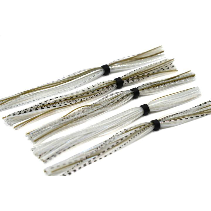 Four bundles of 6th Sense Silicone Skirt fishing lure skirts in translucent and silver with black speckled accents, tied with small black bands.