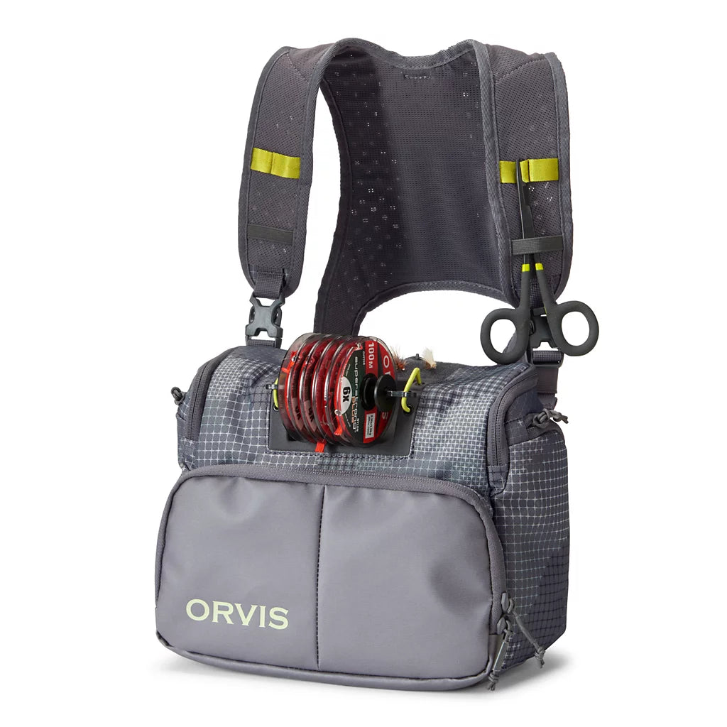 Orvis Chest Pack in gray with padded shoulder straps, front zippered pocket, and attached fishing reel and gear loops designed for convenient fishing tackle storage.