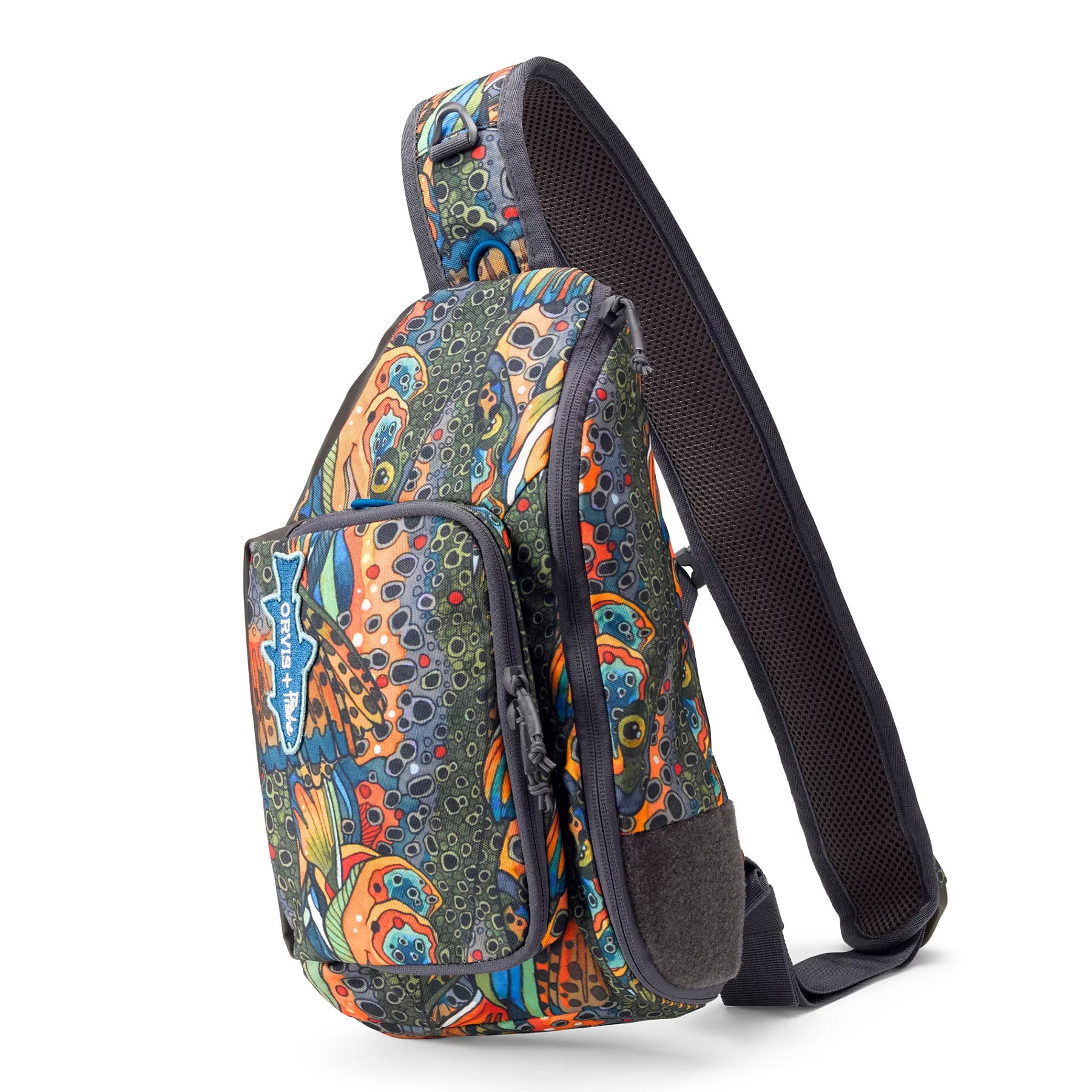 Orvis Mini Sling Pack with colorful, patterned fabric featuring vibrant fish scale and lure-inspired designs, equipped with padded adjustable strap and multiple zippered compartments for fishing tackle storage.