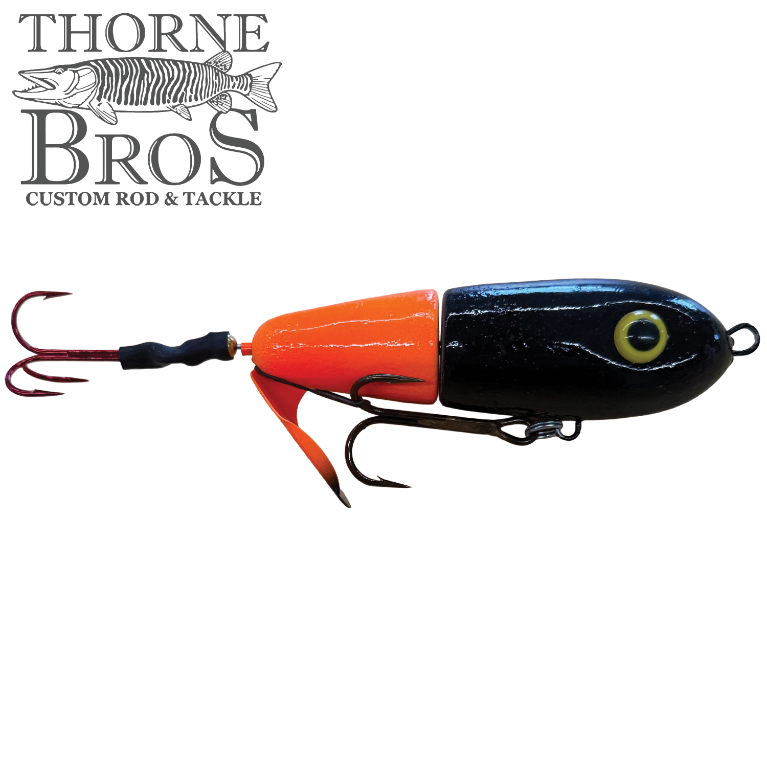 Lake-X Dr. Evil musky fishing lure with segmented black and orange body, realistic yellow eye detail, and multiple sharp treble hooks designed for effective fishing tackle.