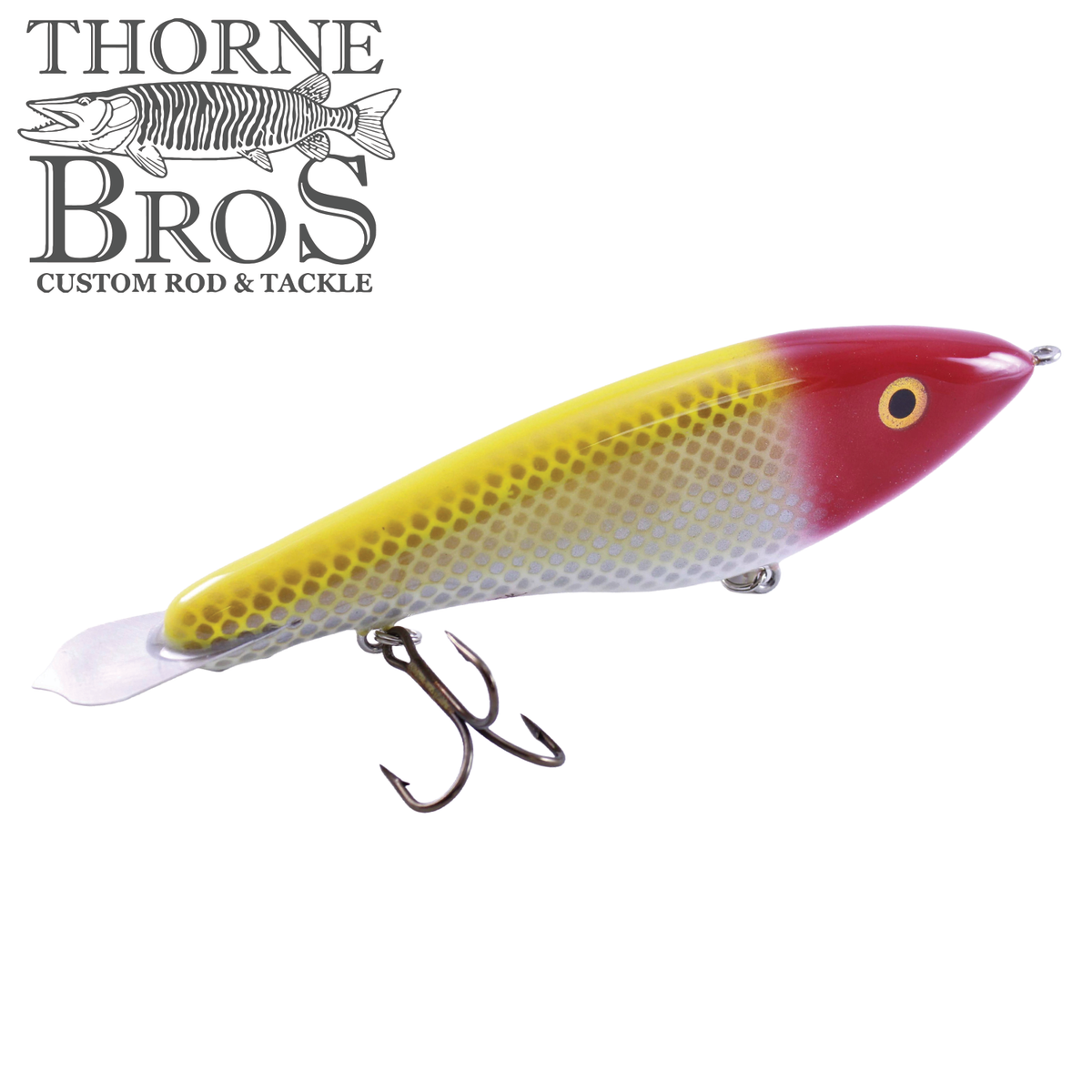 Bitten Warlock - REG. musky fishing lure with yellow and red scaled finish clear tail and two treble hooks for freshwater fishing tackle