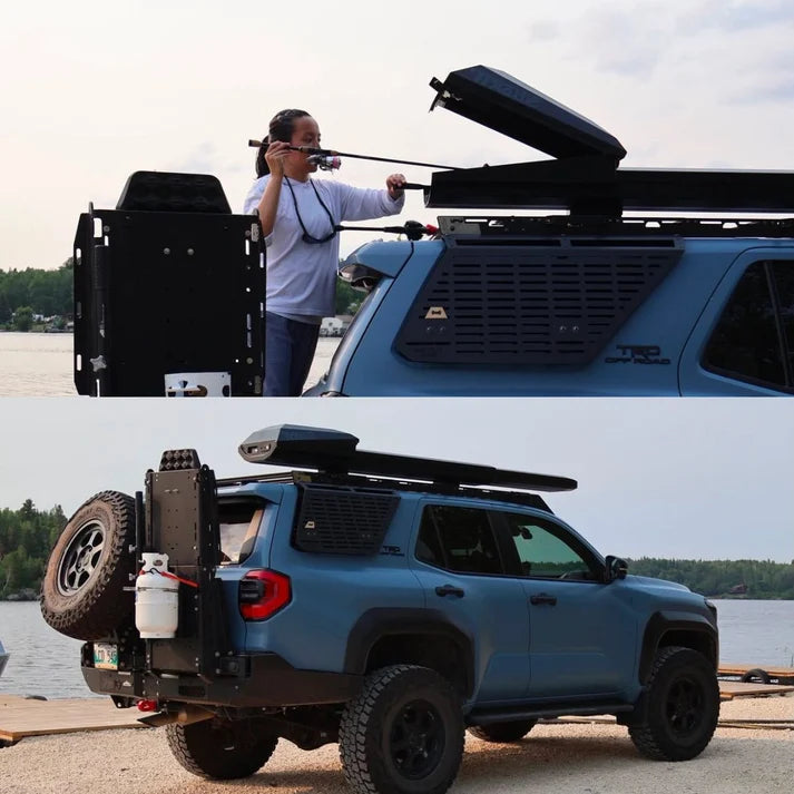 Trxstle ARC Fishing Rod Carrier mounted on a blue SUV with the rooftop case open while an angler loads a fishing rod near a lakeside launch area