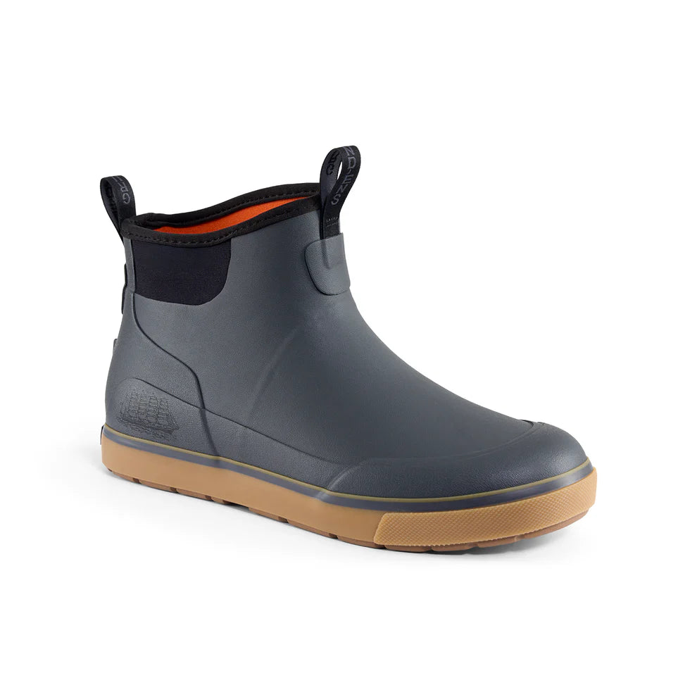 Grundens Deck-Boss Boot in gray with a tan rubber sole, featuring pull tabs on the collar and a neoprene ankle cuff, designed for durable, waterproof fishing footwear.