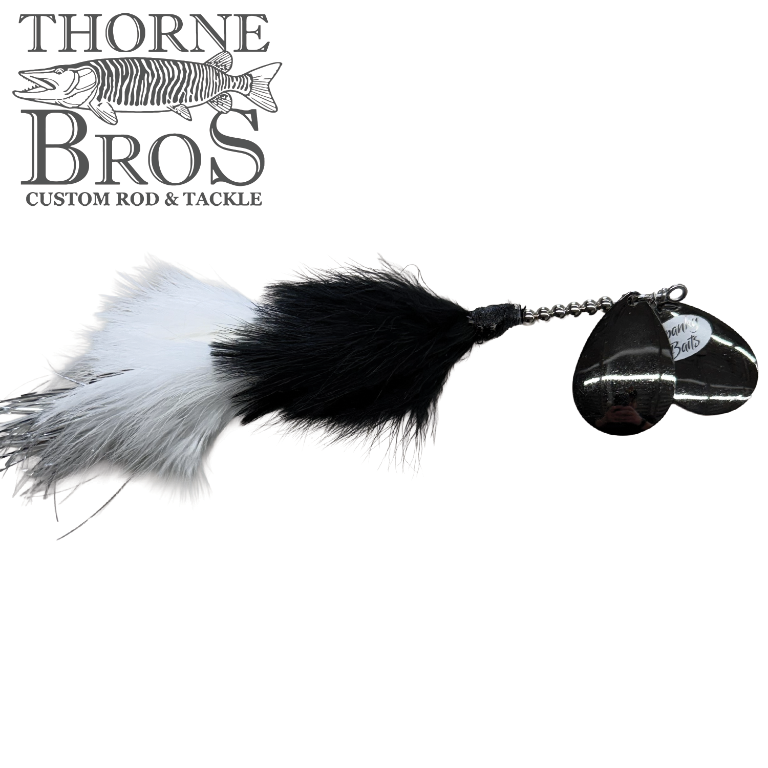 Spanky Baits Raven fishing lure featuring black and white fur with silver spinner blades, designed for musky fishing and available at Thorne Bros Custom Rod & Tackle.
