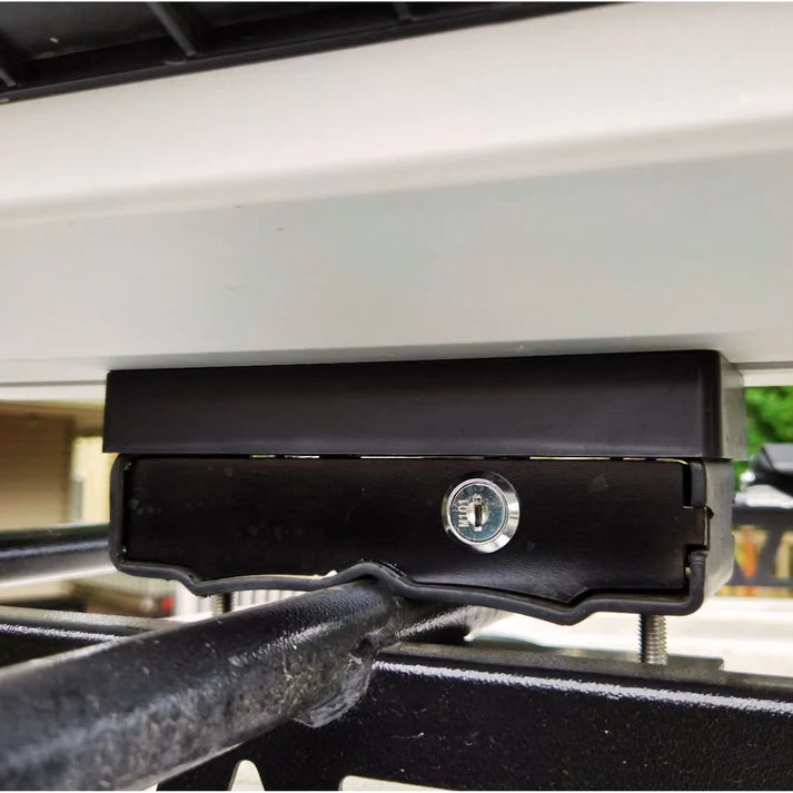 Trxstle ARC Fishing Rod Carrier shown as a black locking rod mount secured to a vehicle rack for organized fishing rods and tackle transport