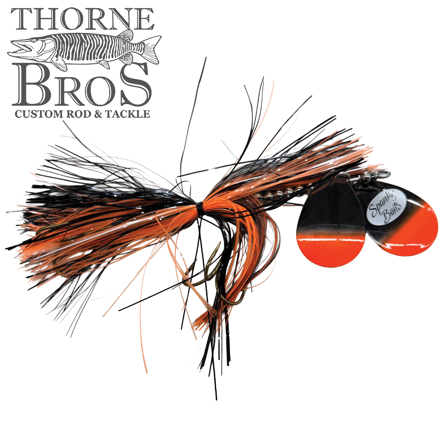 Spanky Baits Fireball 8" fishing lure with black and orange skirt and matching orange and black spinner blades, designed for musky fishing tackle and reels.