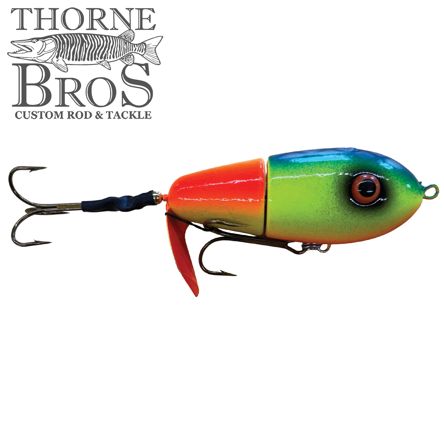 Colorful segmented fishing lure with bright blue, green, and orange-yellow body and two treble hooks, designed for musky fishing, named Lake-X Fat Bastard.