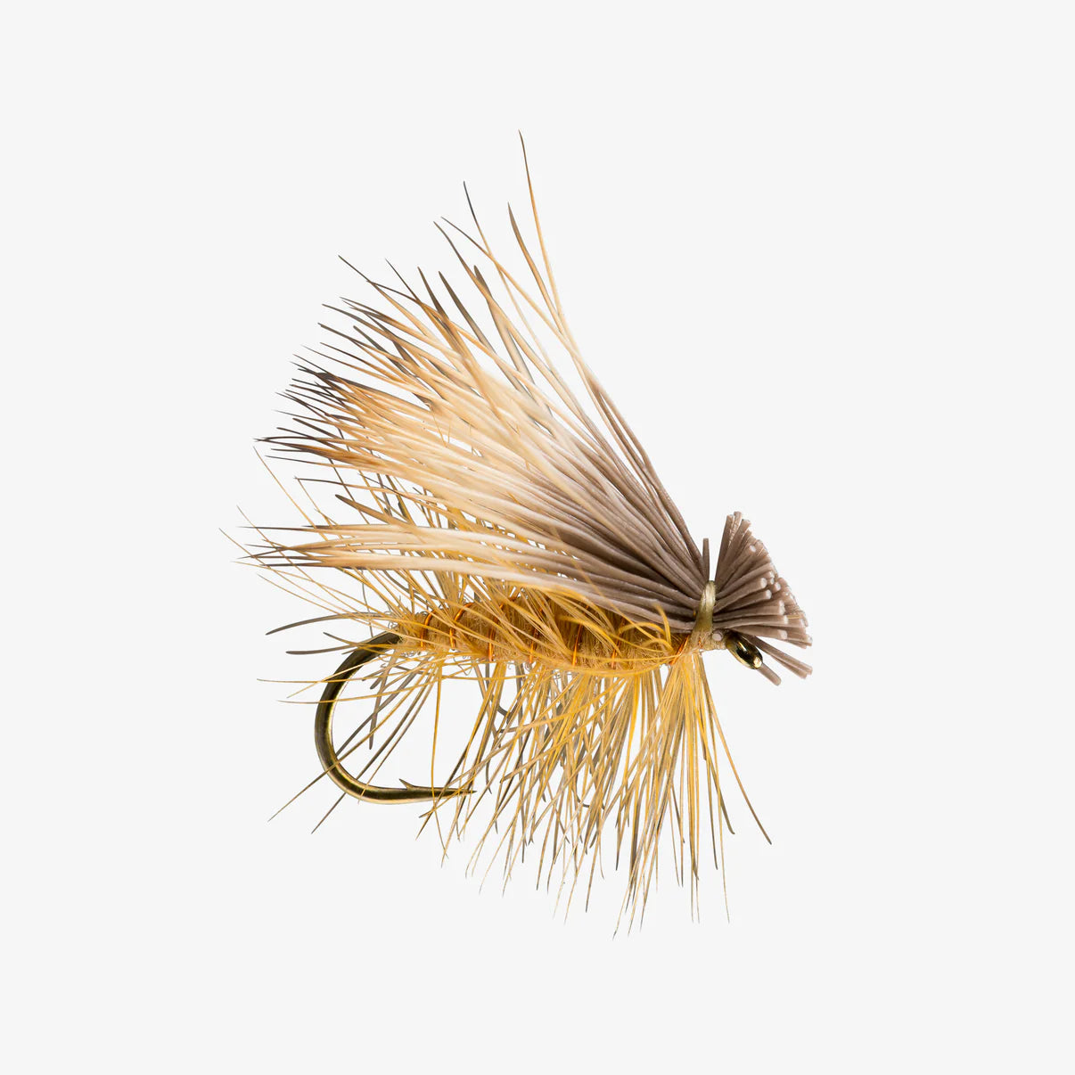 Close-up image of an Elk Hair Caddis fishing lure featuring tan and brown stiff elk hair fibers with a small fishing hook designed for freshwater fly fishing.