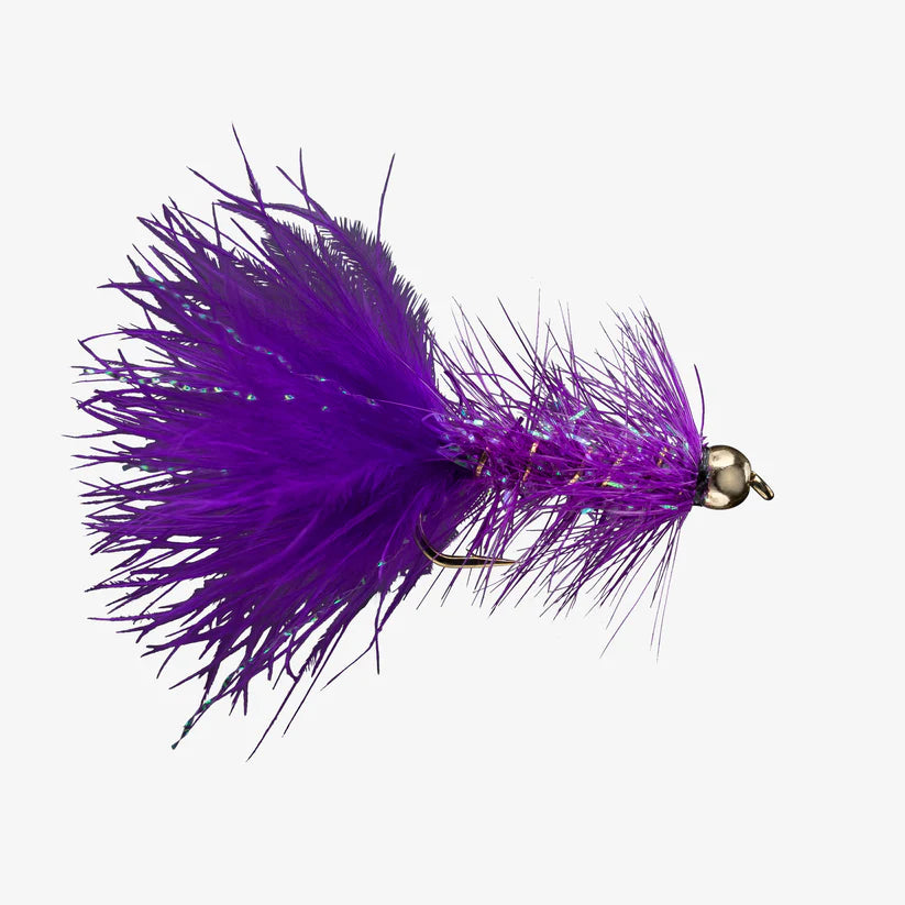Close-up of a purple Wooly Bugger fishing lure with feathery body and metallic bead head, designed for freshwater fishing and musky tackle enthusiasts.