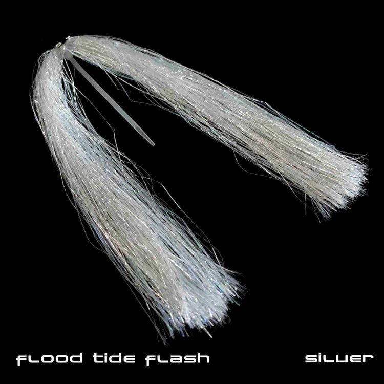 Silver synthetic strands arranged in a fishing lure designed for fly tying, featuring reflective fibers to imitate baitfish movement, known as Sight Cast Flood Tide Flash.