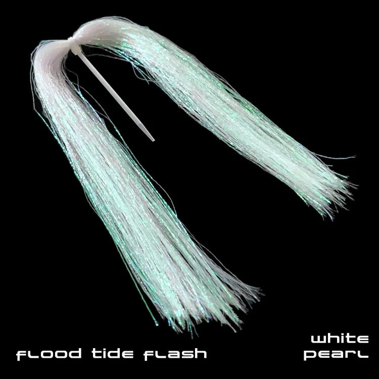 Close-up of Sight Cast Flood Tide Flash fishing lure in white pearl color, showing shimmering synthetic fibers designed to attract fish in various water conditions.