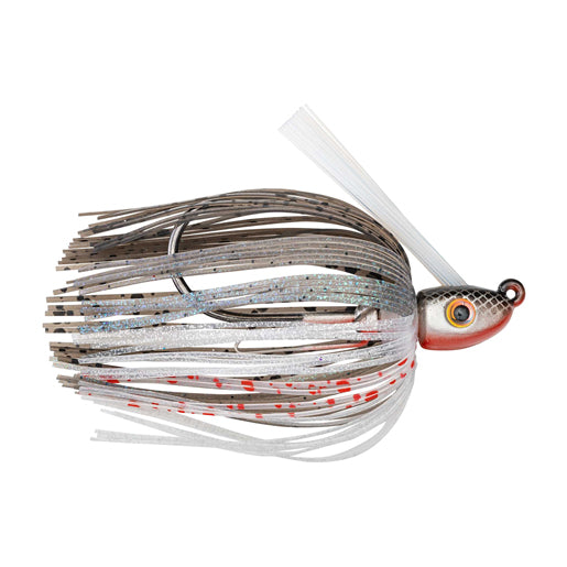 Strike King Hack Attack Heavy Cover Swim Jig featuring a detailed jig head with large yellow and black eye, multi-colored skirt with brown, white, silver, and red accents, designed for fishing tackle use.