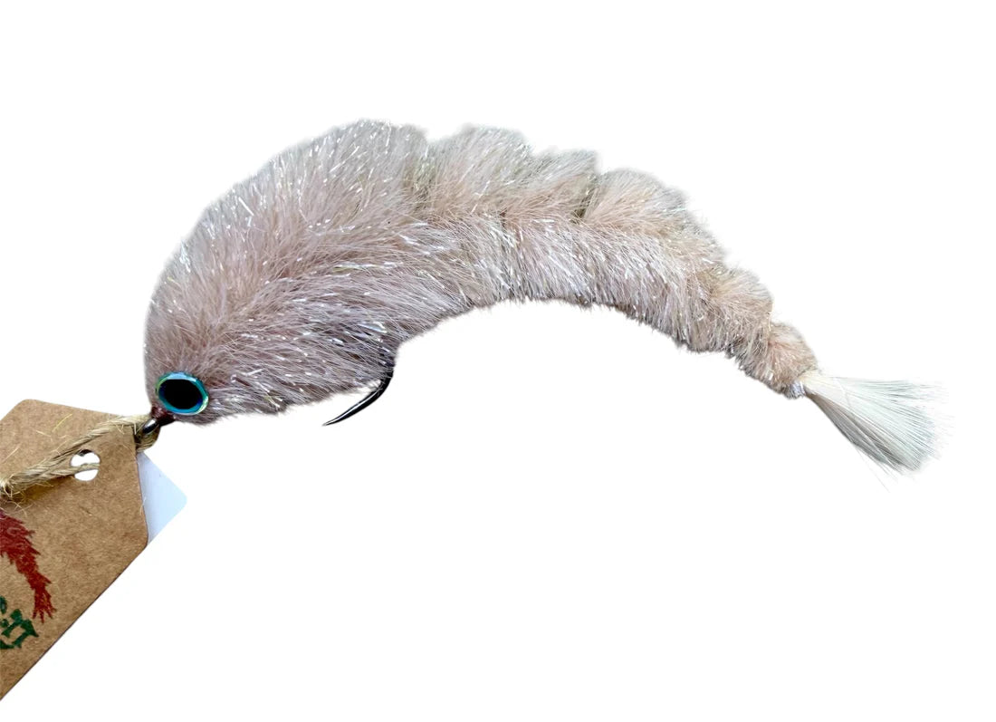 Close-up of a light beige, segmented fishing lure with a shiny blue eye and soft textured body, identified as the Chocklett Factory Finesse Changer, designed for precision fishing tackle.