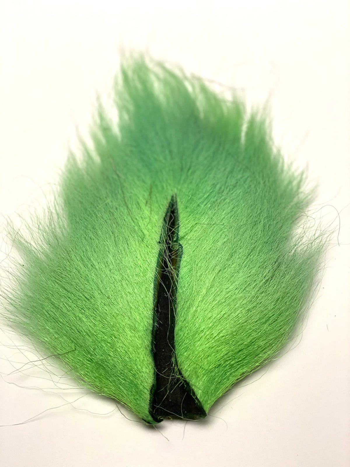 Marabou Brothers El Presidente Grade Buck Tail green fishing lure with a fluffy marabou skirt and black center for musky fishing tackle