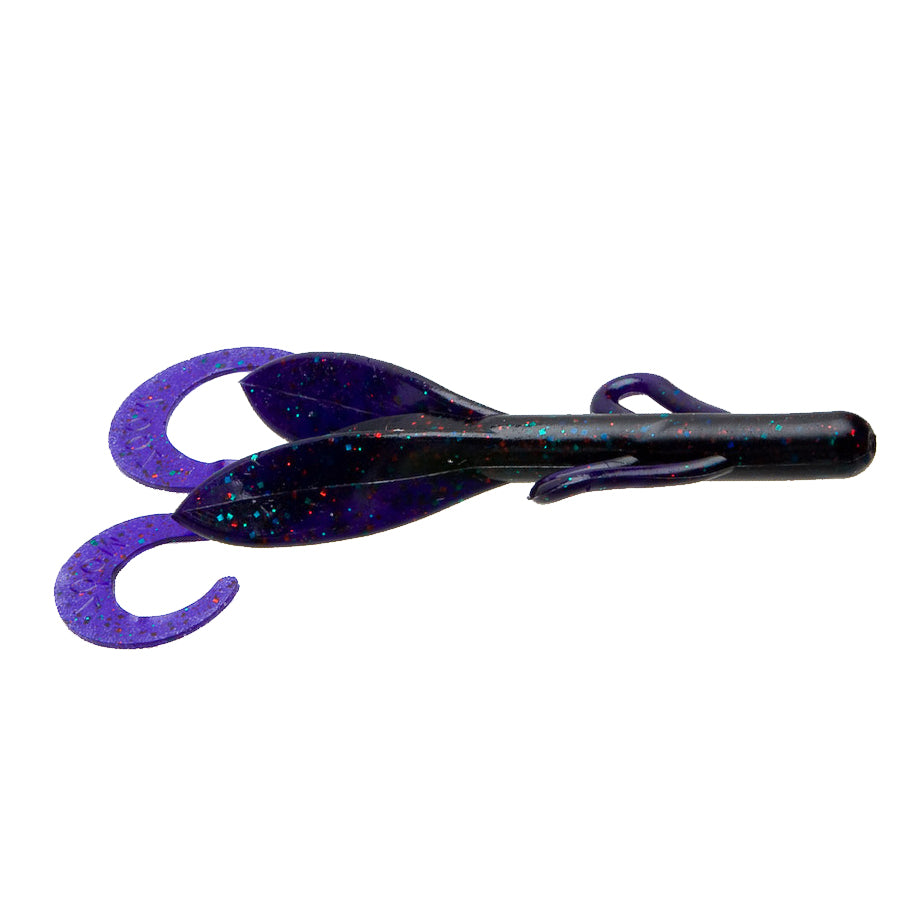 Zoom Brush Hog fishing lure in dark purple with glitter, featuring a soft plastic body and two curled tail appendages for realistic movement in water.