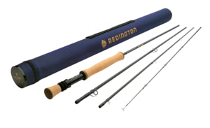 Redington Big Game Fly Rods displayed disassembled with cork handle and black reel seat, alongside a navy blue protective rod tube for fishing tackle.