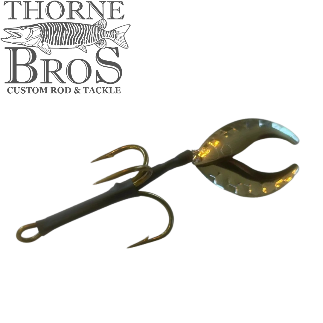 Angling Revolution Whiptail musky fishing lure with twin curled tails and large treble hook shown on a white background from Thorne Bros