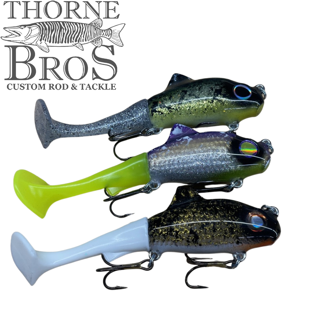 Zilla Baits TicTak musky fishing lures in three colors with treble hooks beside the Thorne Bros Custom Rod and Tackle logo
