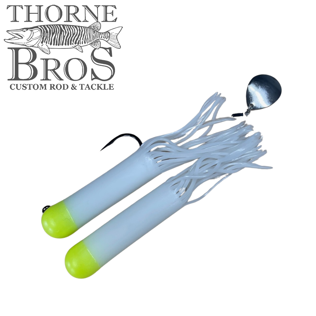 Drop Tine Chunker Tubes fishing tackle featuring two white and chartreuse soft plastic tubes with fringed skirts, one equipped with a silver spinner blade and a hook.