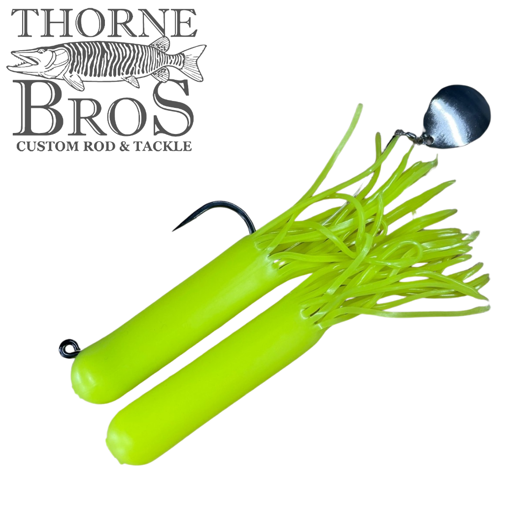 Bright chartreuse fishing lure with flexible skirt strands and a single hook, featuring a reflective silver spinner blade, designed as Drop Tine Chunker Tubes for fishing tackle.
