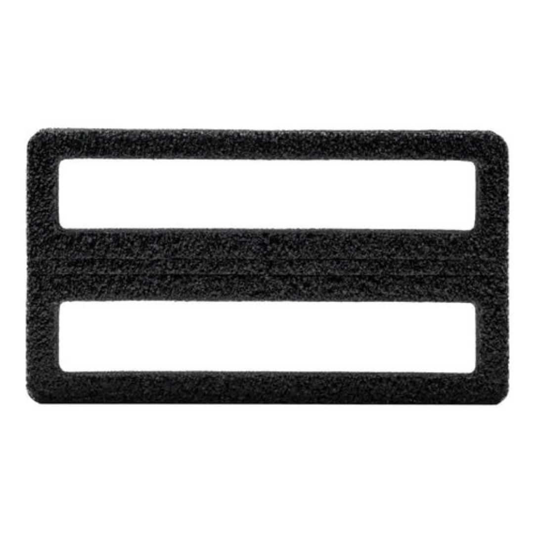 Black rectangular fishing tackle accessory made of textured material with two horizontal slots, designed for securing gear, identified as Spro Coike Keeper.