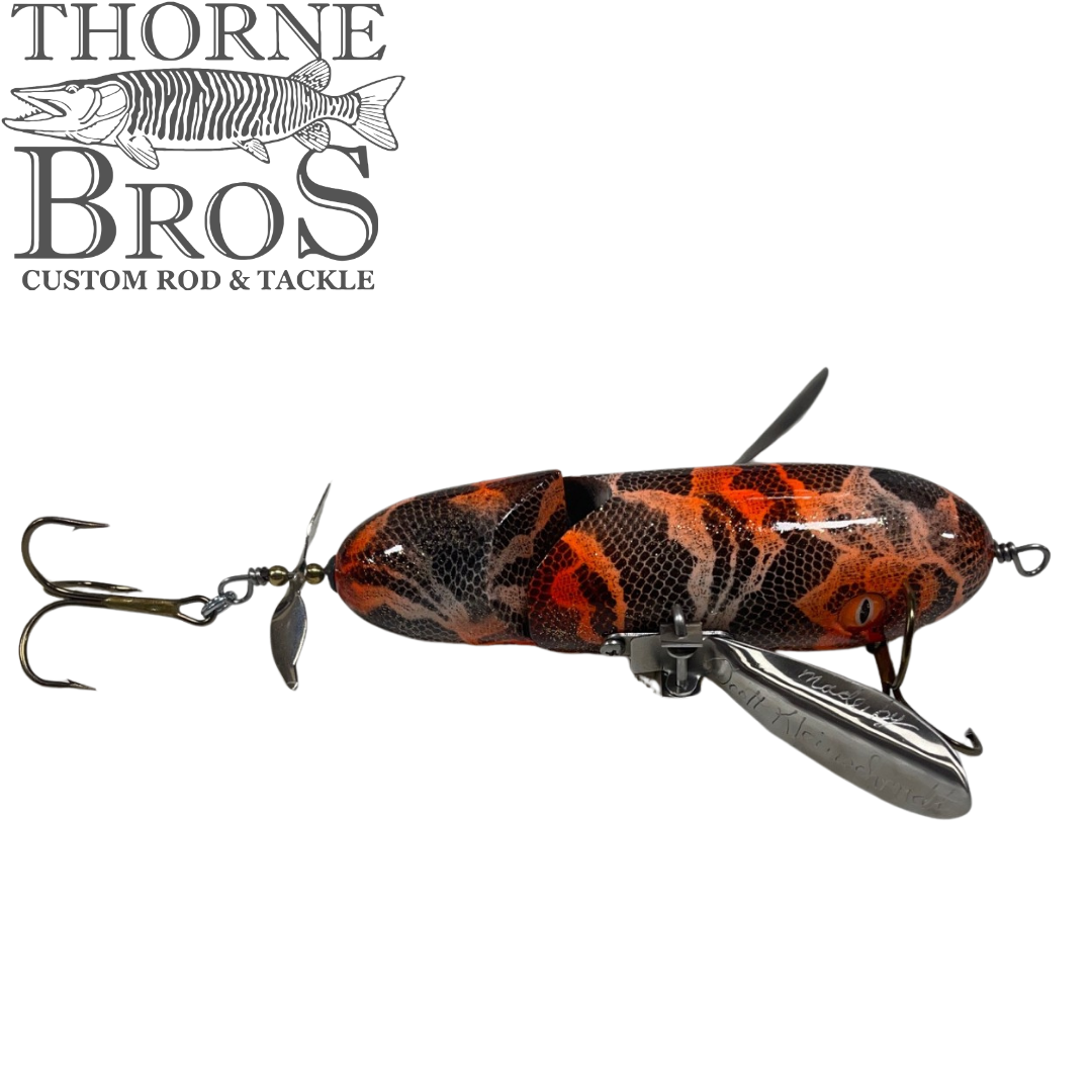Simulated alt text for Musky Safari Jointed Spitzer for thorne-bros-custom-rod-tackle.myshopify.com. You are an expert SEO agent. You will generate an ALT text for this image. <Store_Context> Business Details: - Premier Midwest shop specializing in musky tackle...