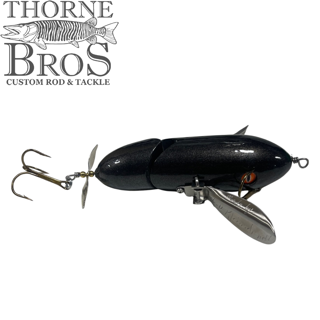 Simulated alt text for Musky Safari Jointed Spitzer for thorne-bros-custom-rod-tackle.myshopify.com. You are an expert SEO agent. You will generate an ALT text for this image. <Store_Context> Business Details: - Premier Midwest shop specializing in musky tackle...