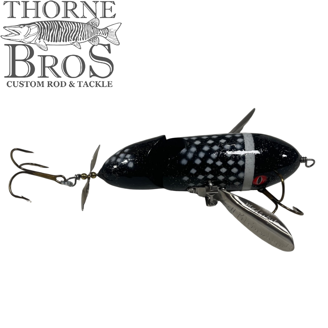 Simulated alt text for Musky Safari Jointed Spitzer for thorne-bros-custom-rod-tackle.myshopify.com. You are an expert SEO agent. You will generate an ALT text for this image. <Store_Context> Business Details: - Premier Midwest shop specializing in musky tackle...