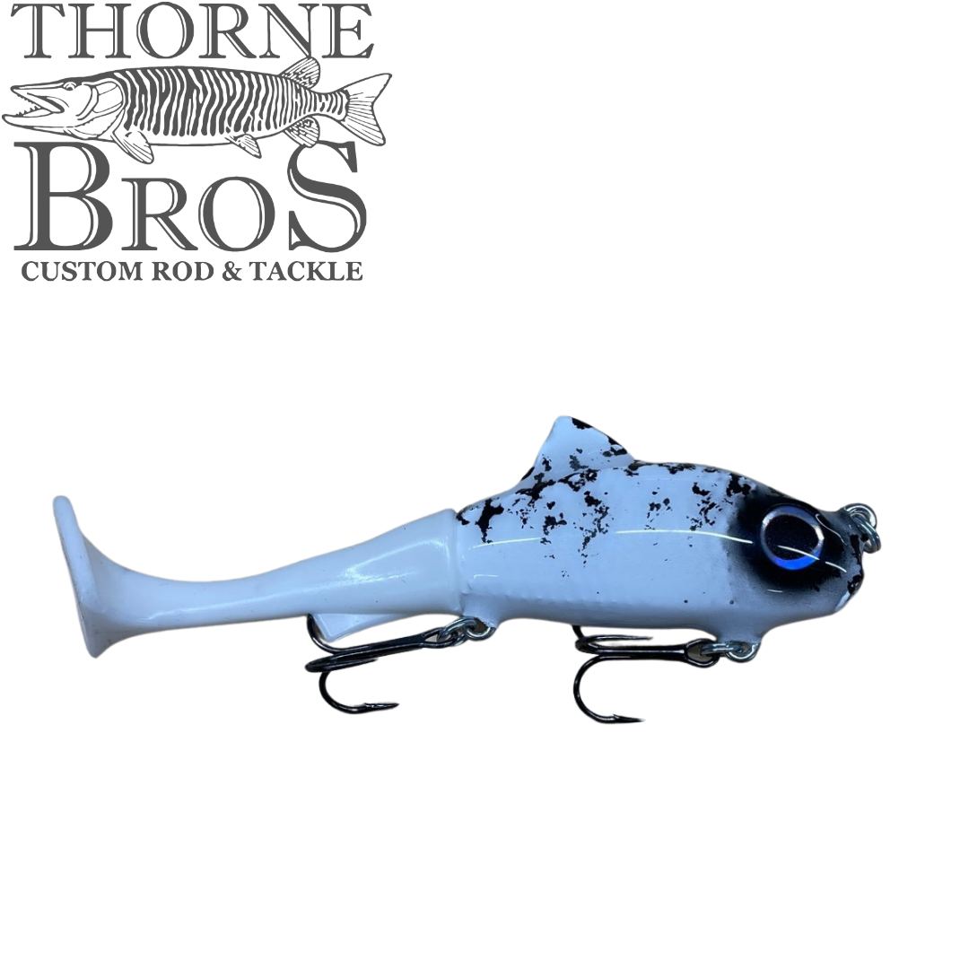 Zilla Baits TicTak blue musky fishing lure with a black speckled body and treble hooks shown on a white background