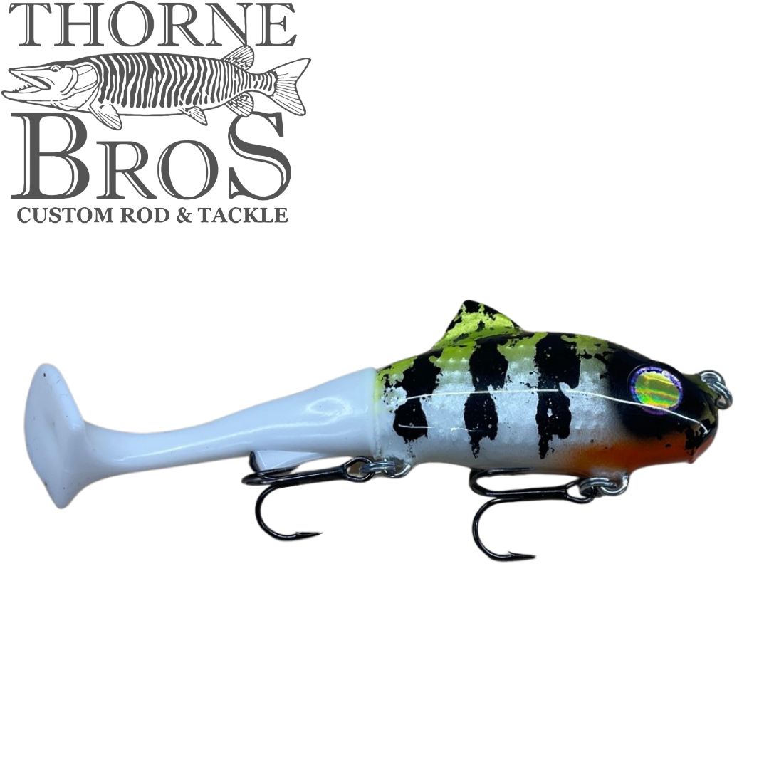 Zilla Baits TicTak musky fishing lure with a blue tail black striped body treble hooks and reflective eye displayed on a white background