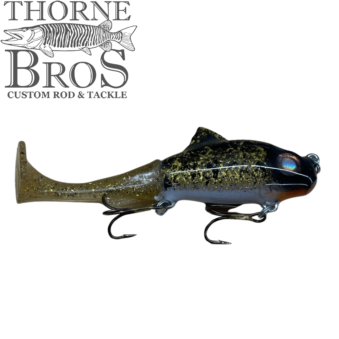 Zilla Baits TicTak black and olive musky fishing lure with a paddle tail textured body and two treble hooks for fishing tackle enthusiasts