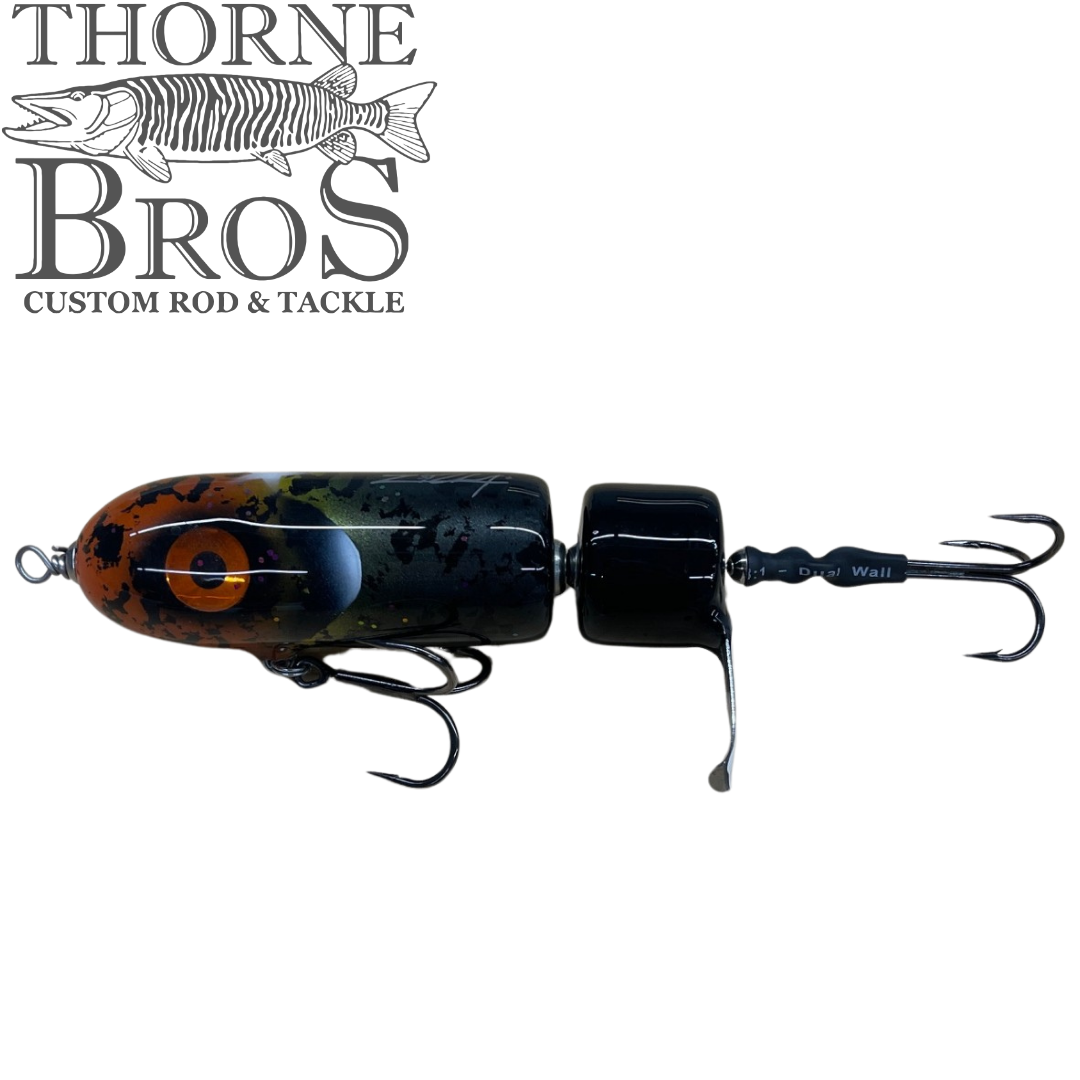 Zilla Baits PropWash musky fishing lure with propeller tail and treble hooks in a dark mottled finish for freshwater fishing