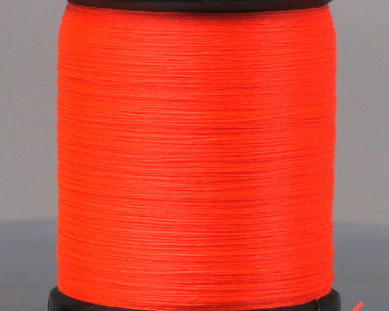 Close-up of bright orange UNI 8/0 Thread spool used for tying fishing lures and custom fishing rods, designed for precision and durability in fishing tackle applications.