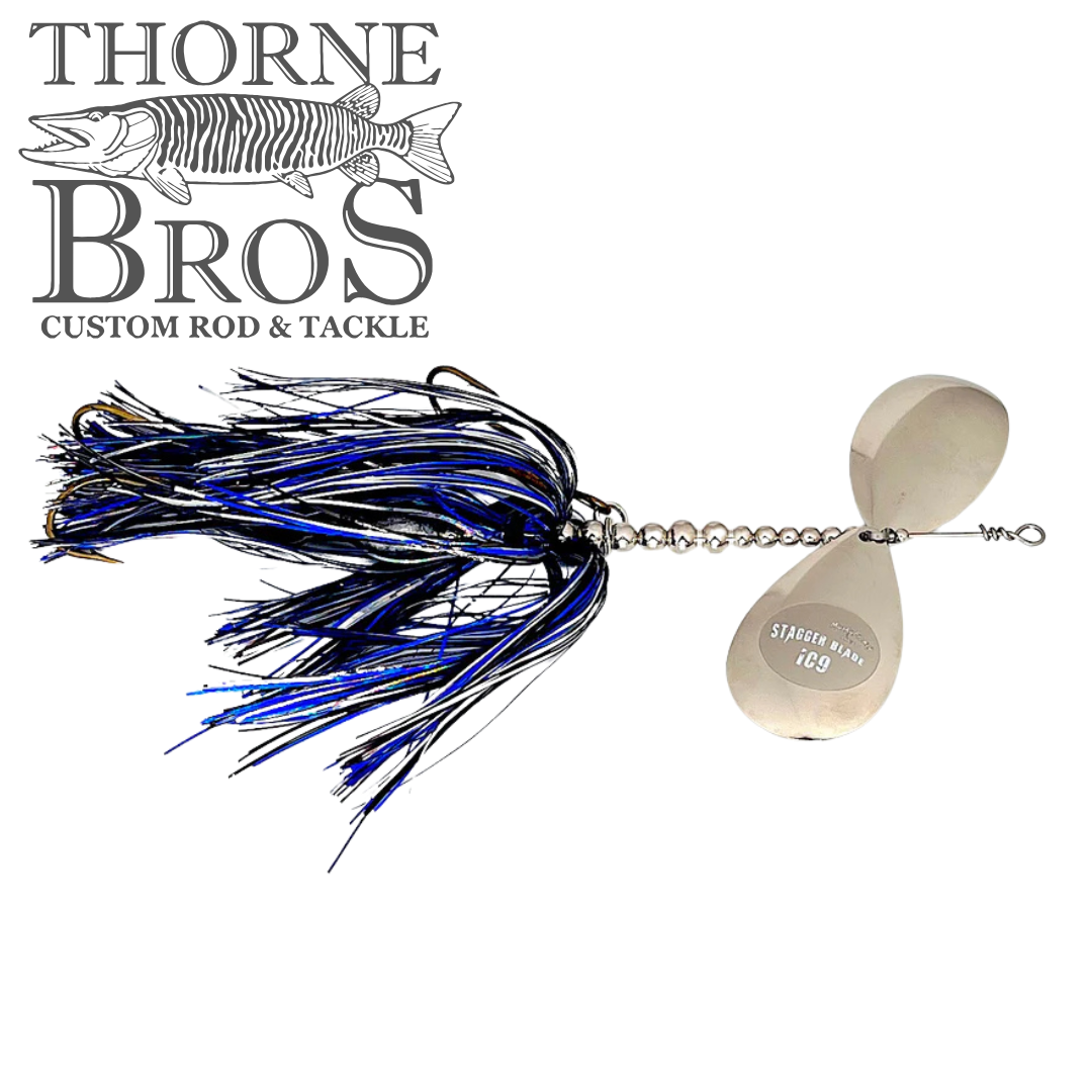 Musky Frenzy Apache Stag IC9 fishing lure with black and blue skirt, silver bead chain, and two silver spinner blades, designed for musky fishing tackle.