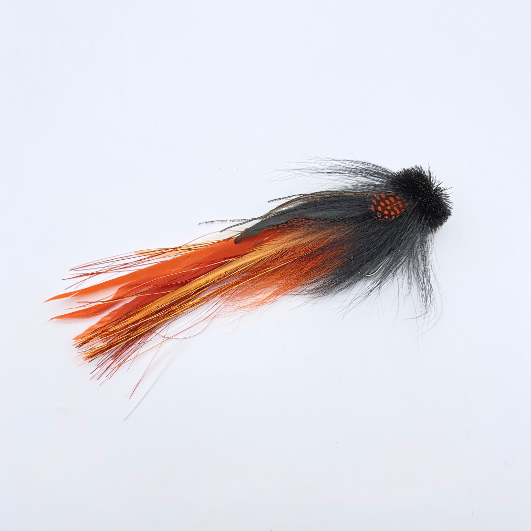 Single Buford Urban Fly Co. fishing lure with black and orange feathers designed for fly fishing and targeting musky and other game fish.