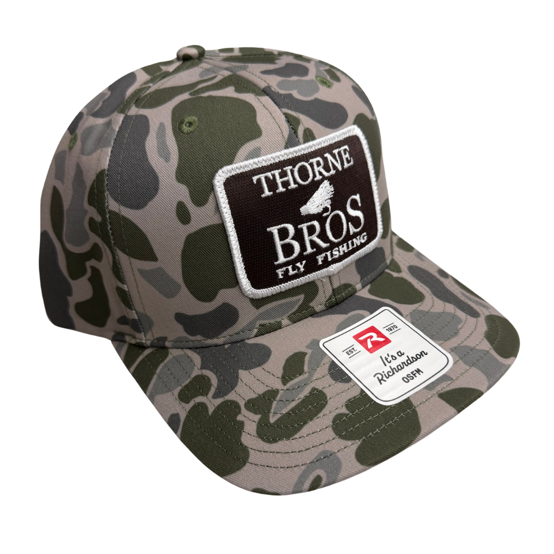 Thorne Bros Fly Fishing Logo Richardson 312P camouflage fishing cap with embroidered front patch and adjustable snapback closure for anglers