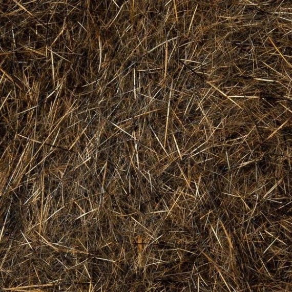 Wapsi Natural Fur Dubbing shown as brown and tan fibers for creating custom fly fishing patterns and fishing tackle
