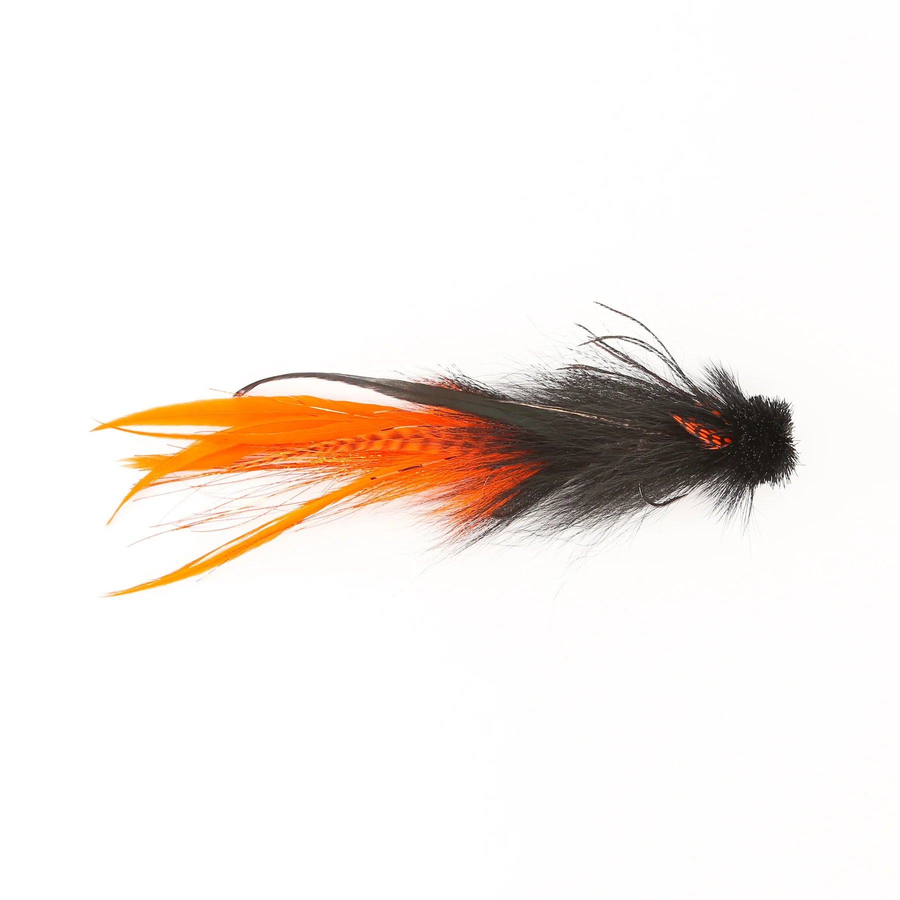 Close-up of the Double Buford Urban Fly Co. fishing lure featuring vibrant orange and black feathers designed for fly fishing and musky tackle.