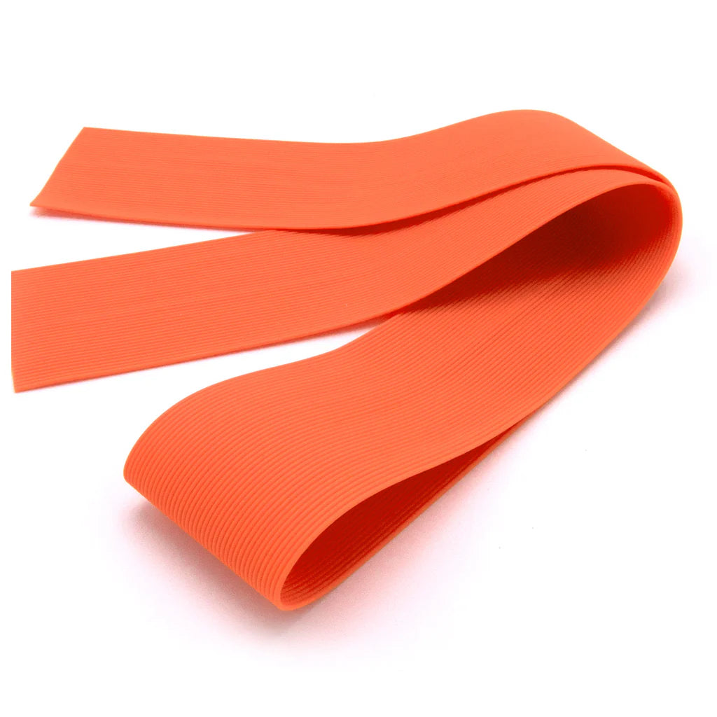 Wapsi Round Rubber Legs Medium in bright orange, flexible ribbed synthetic material used for crafting fishing lures and tackle components.