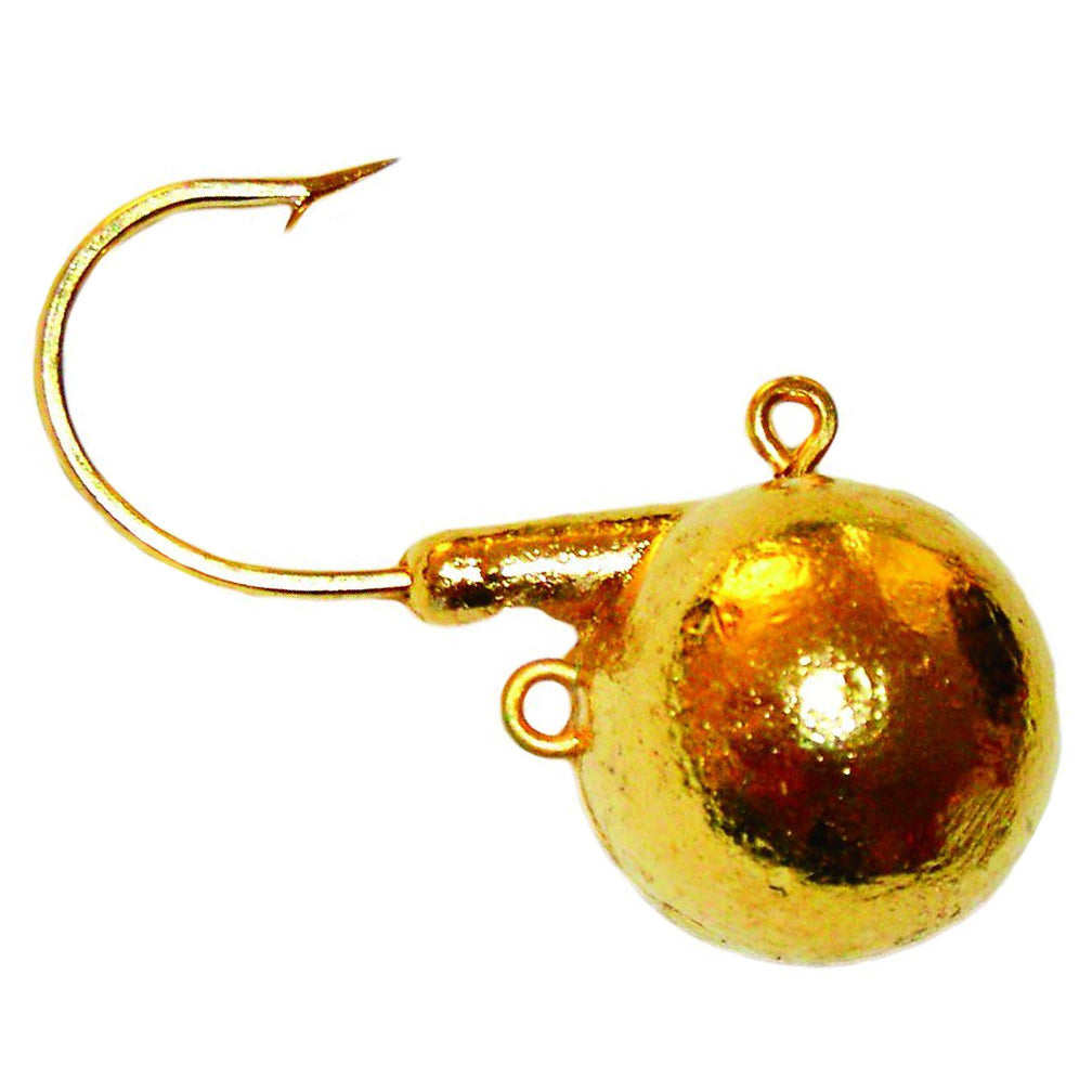 Close-up of a gold-colored fishing jig with a sharp hook and two attachment loops, designed as the Mission Tackle Short Shank Jig for fishing tackle use.
